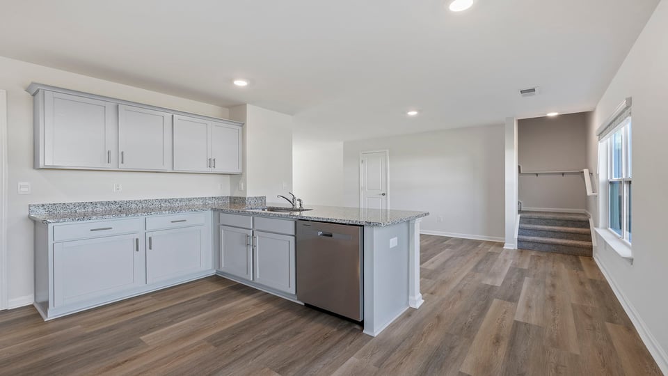 Kitchen with granite countertops and stainless steel appliances.