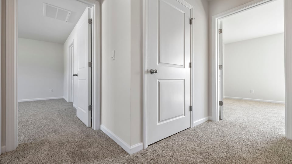 outside secondary bedrooms looking into bedrooms.