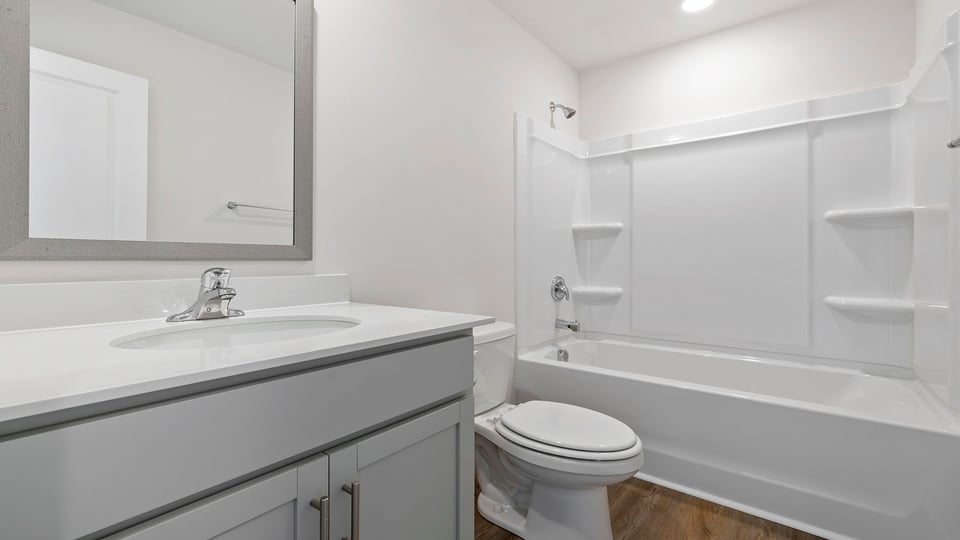 Bathroom with vanity and tub.