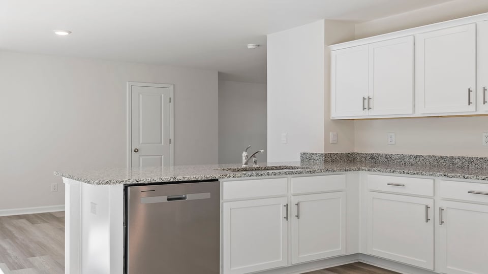 Kitchen with granite countertops and stainless steel appliances.