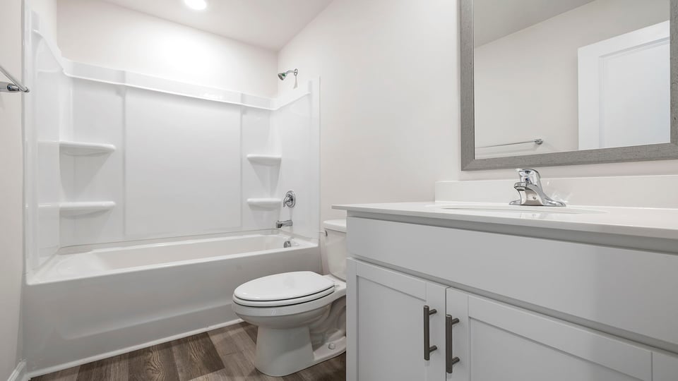 Bathroom with vanity and tub.