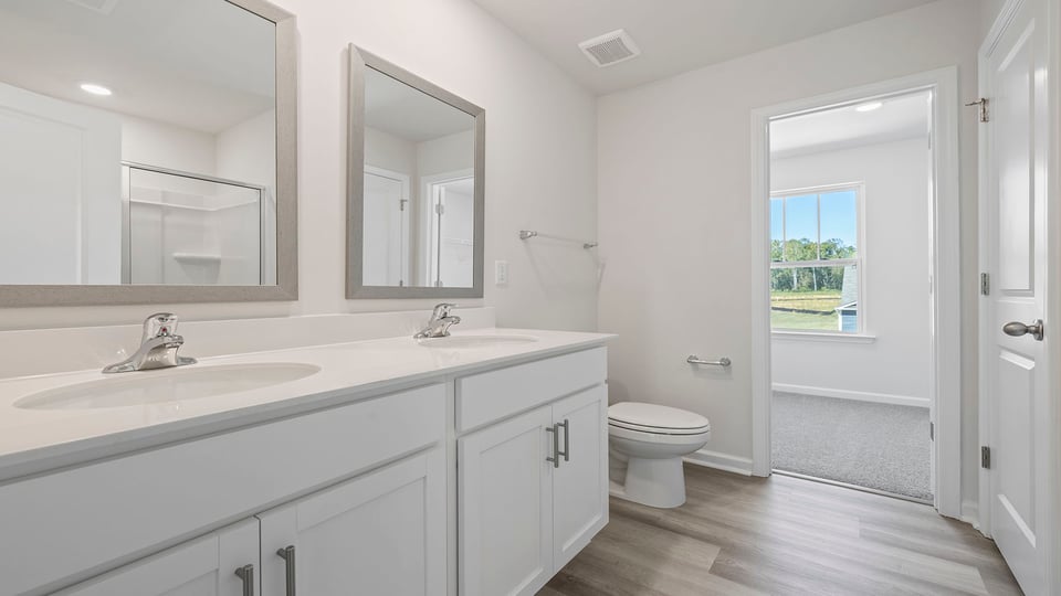 Bathroom with vanity and walk in shower.