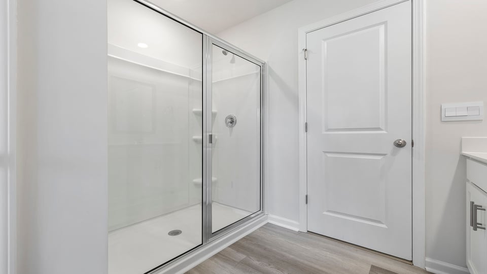 Bathroom with walk in shower.