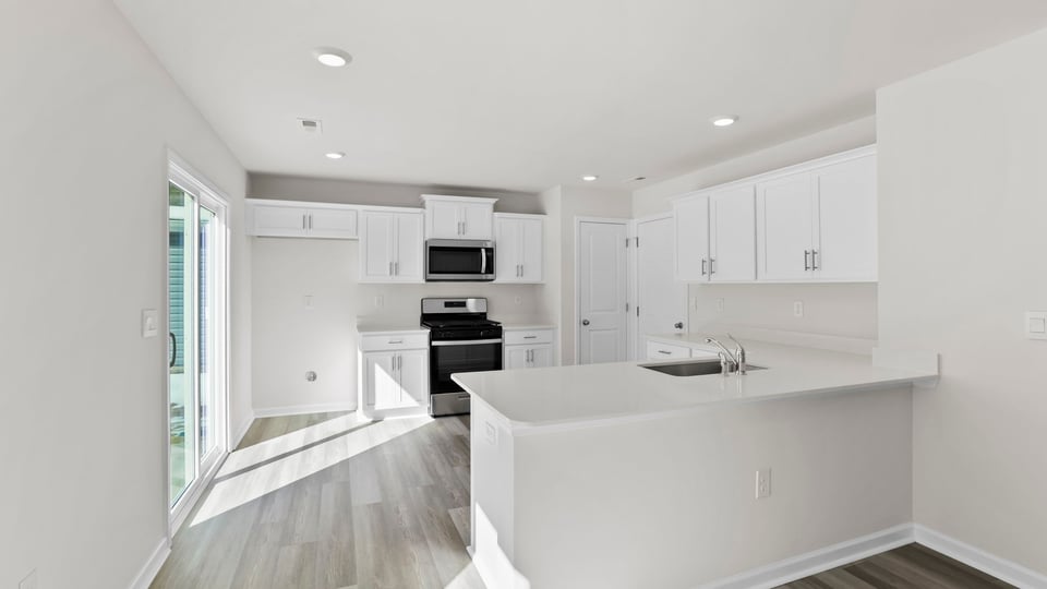 Kitchen with quartz countertops.