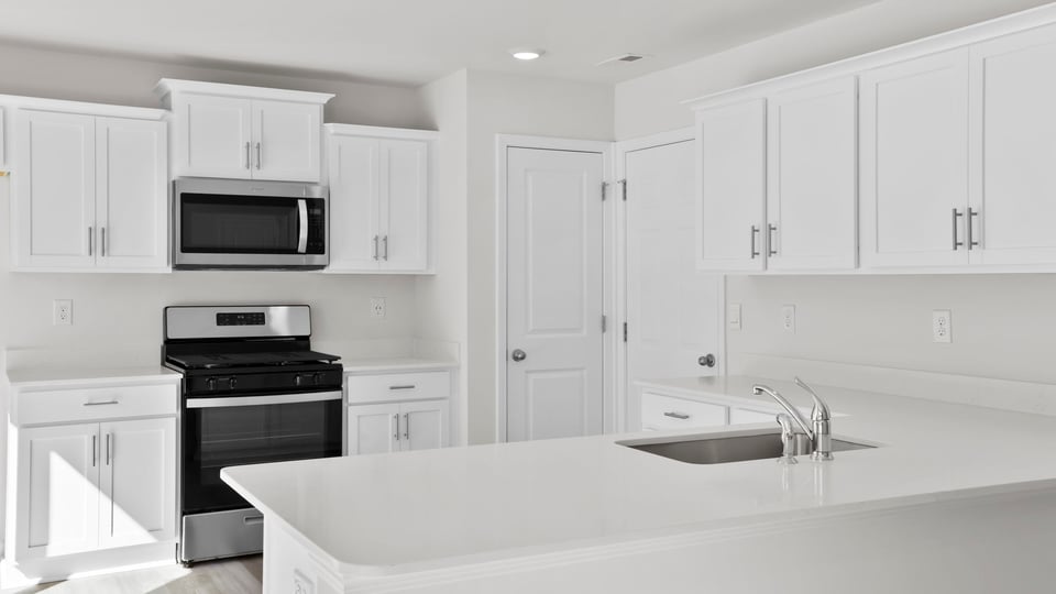 Kitchen with quartz countertops.