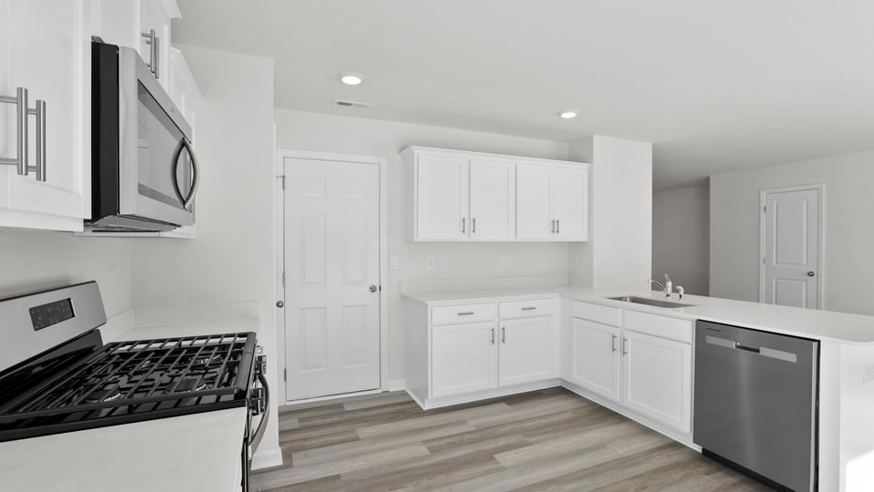 Kitchen with quartz countertops.