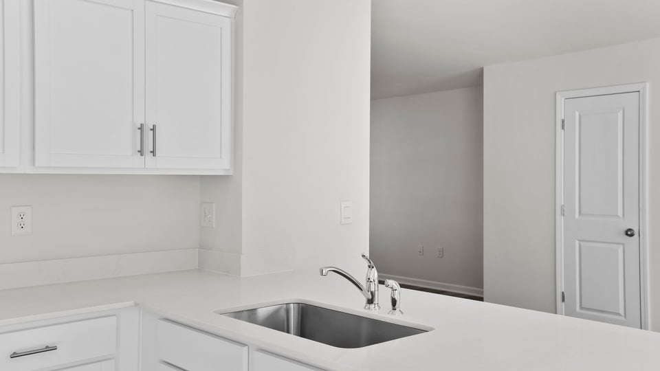 Kitchen with quartz countertops.
