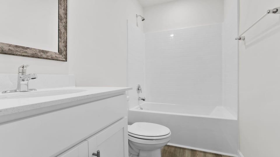 Bathroom with vanity and tub.