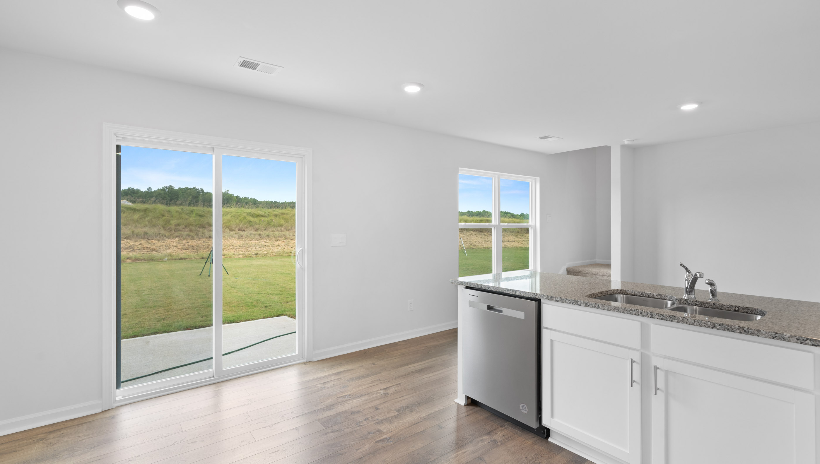 View of kitchen and silding room.