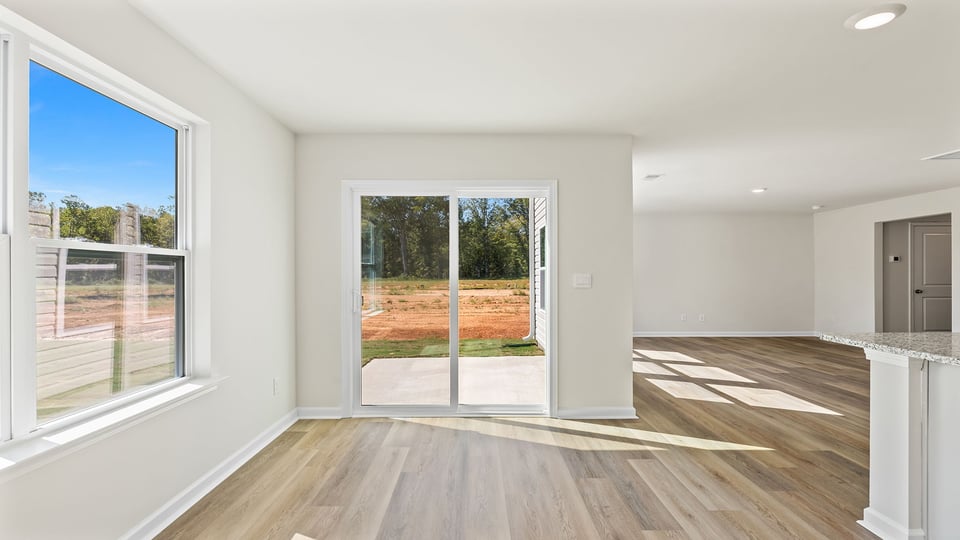 Breakfast area with window and sliding doors.