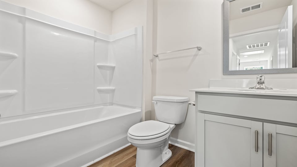 Bathroom with vanity and tub.