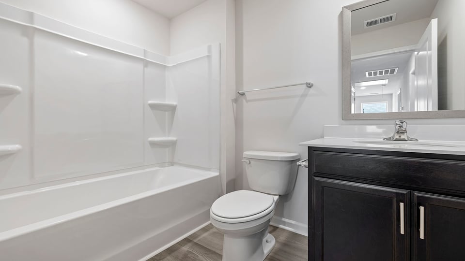 Bathroom with vanity and tub.