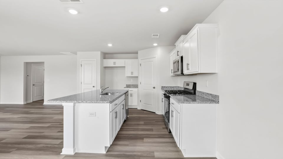 View of kitchen with island.