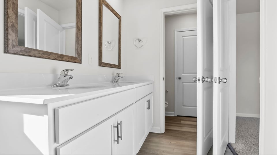 Primary bathroom with dual sink vanity.