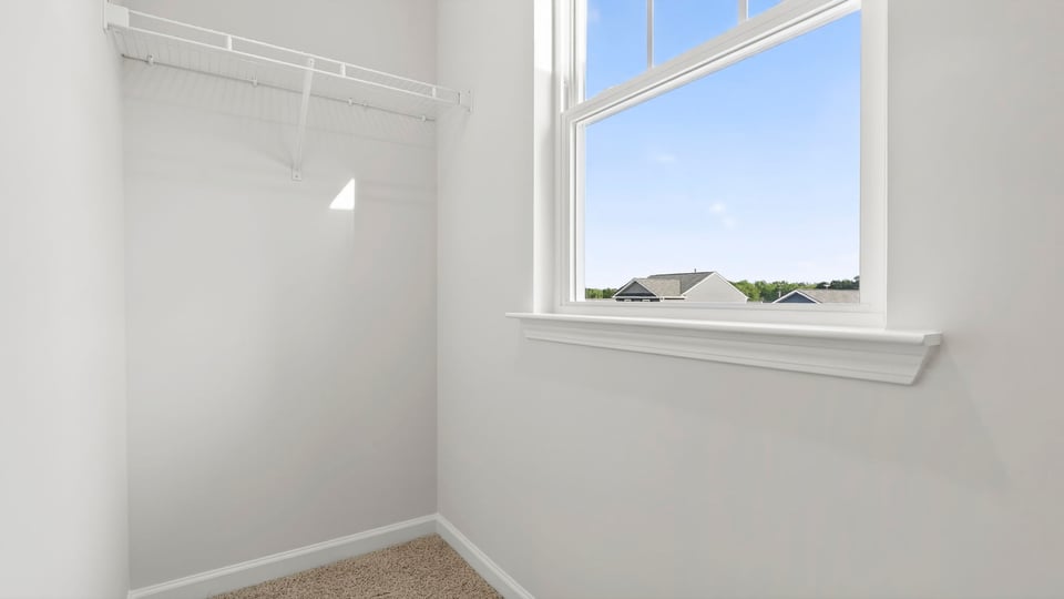 Primary bedroom walk-in closet.