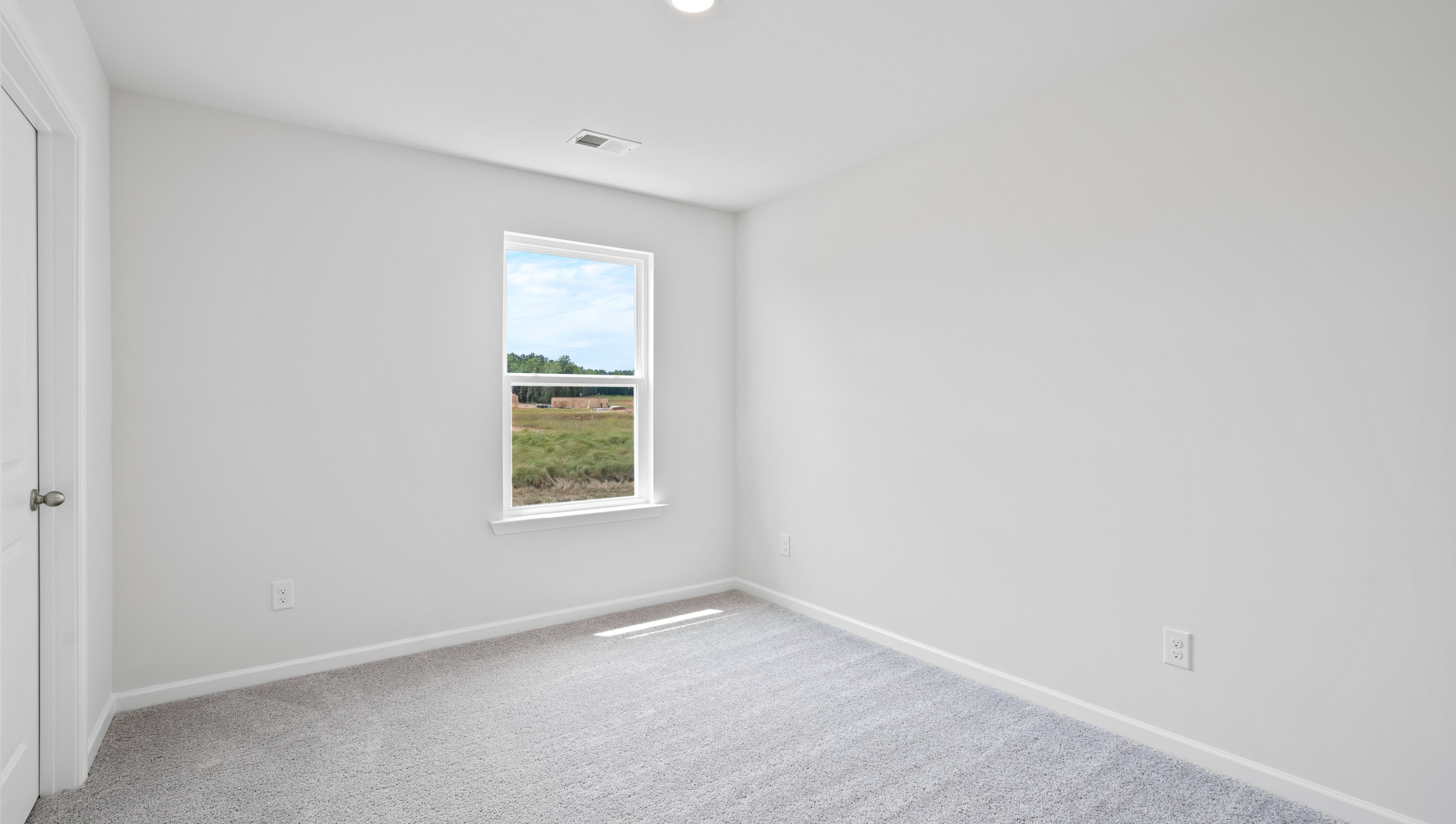 Bedroom with carpet.