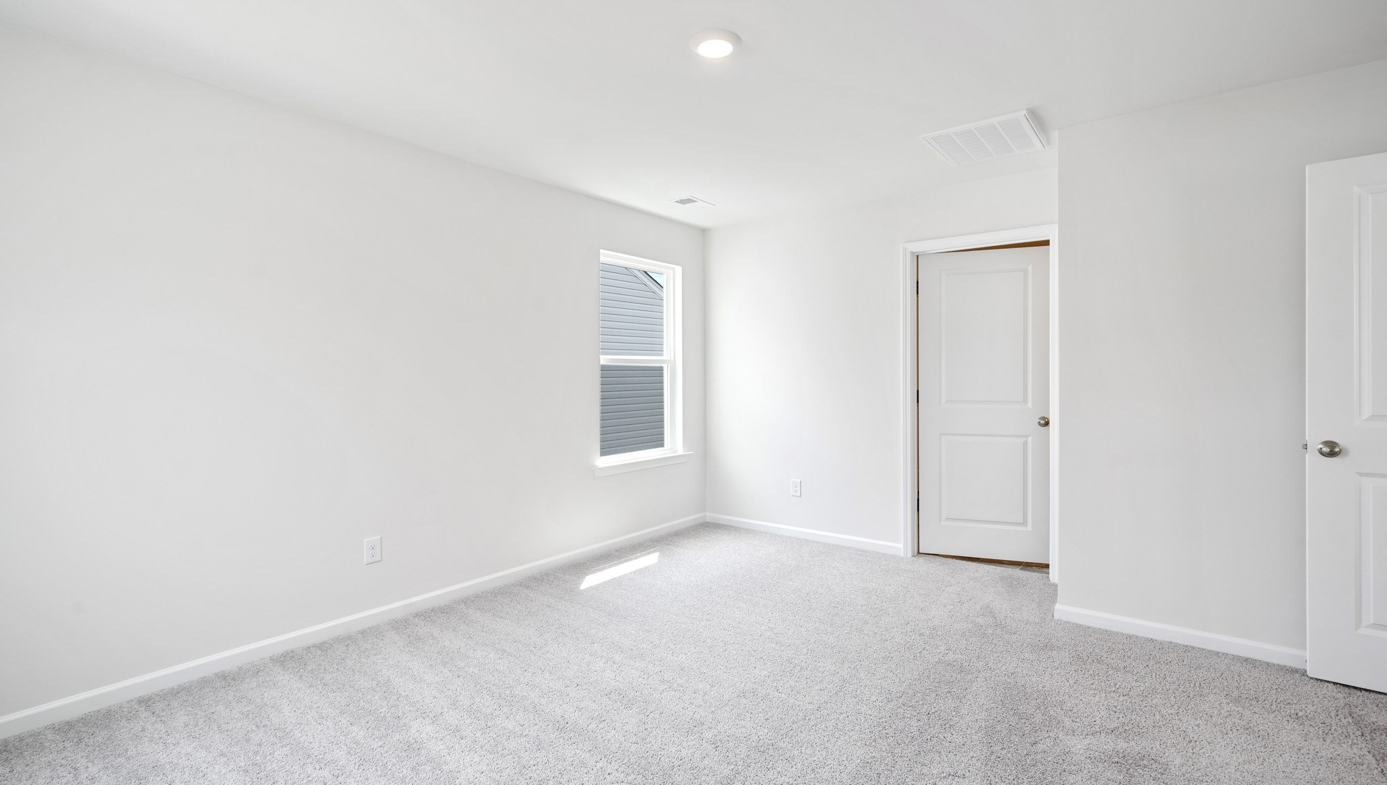 Bedroom with carpet.