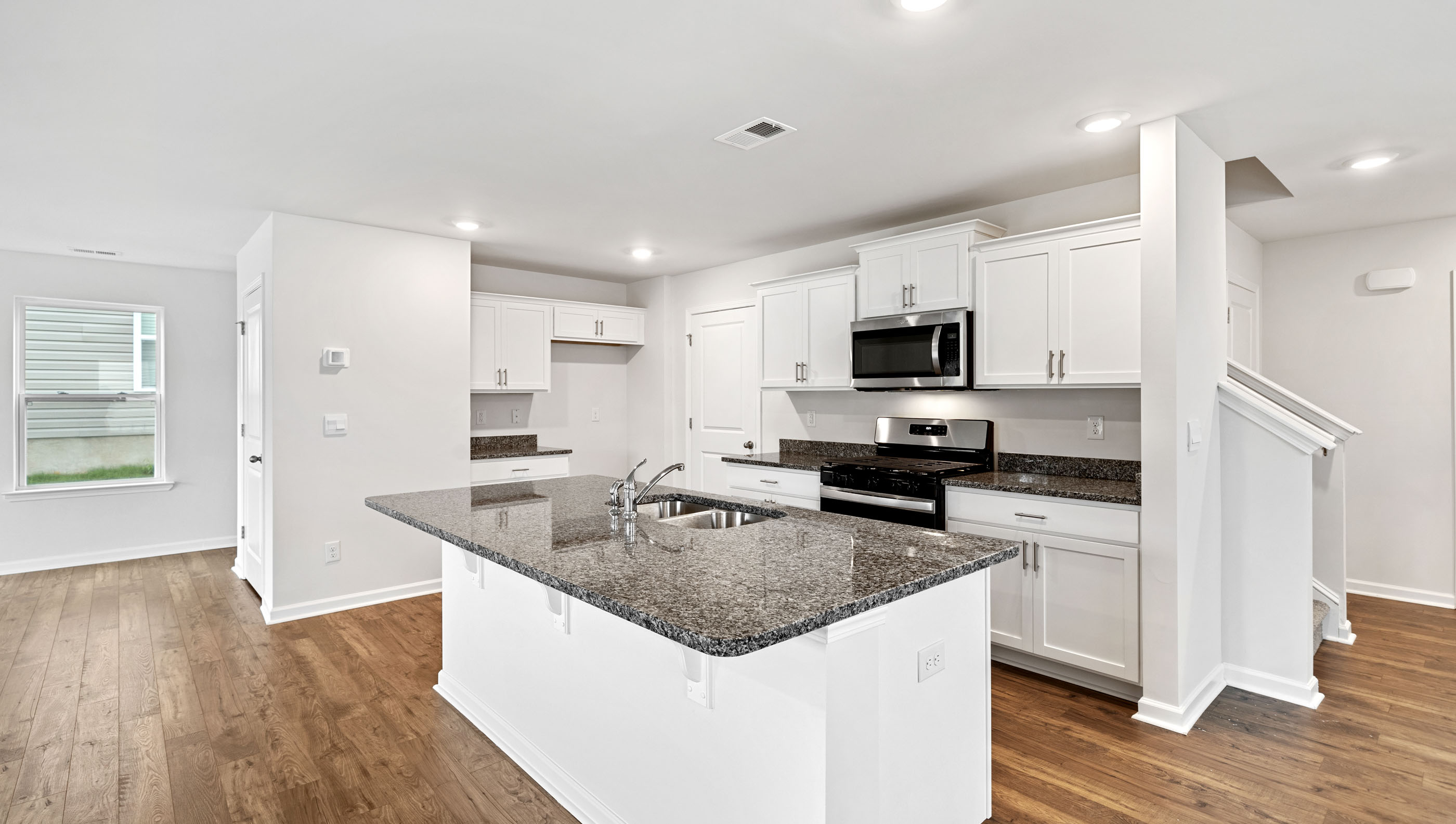 Kitchen with granite island.