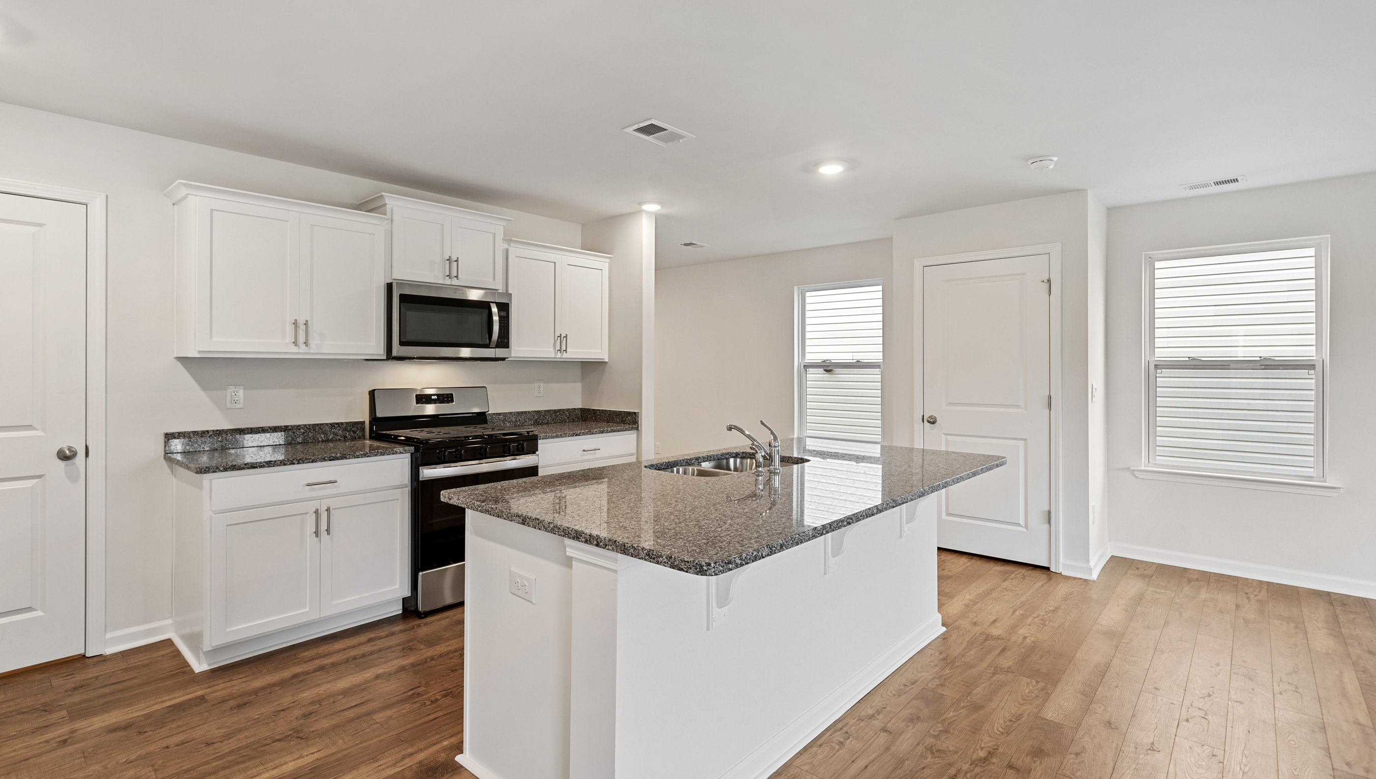 Kitchen with granite island.