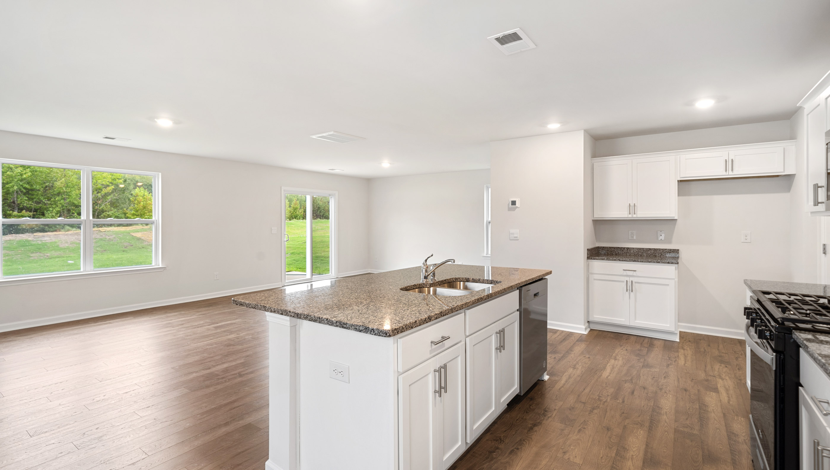 Kitchen island with view of family room.