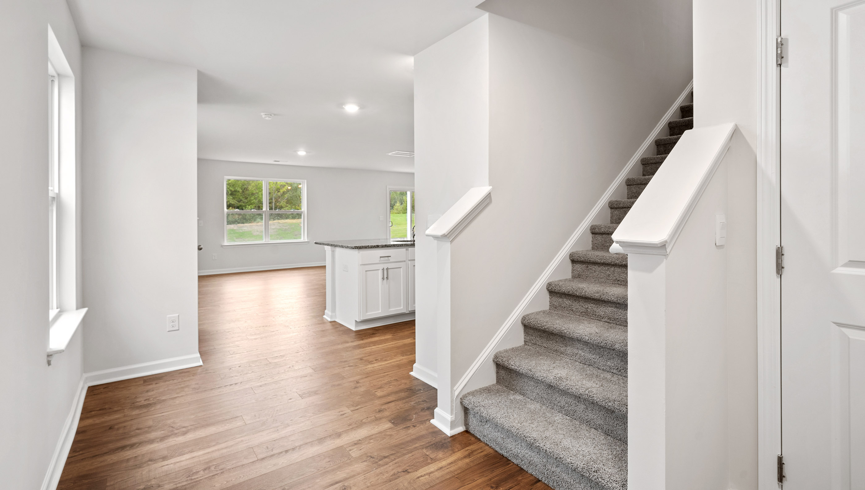 Foyer with starcase to upstairs.