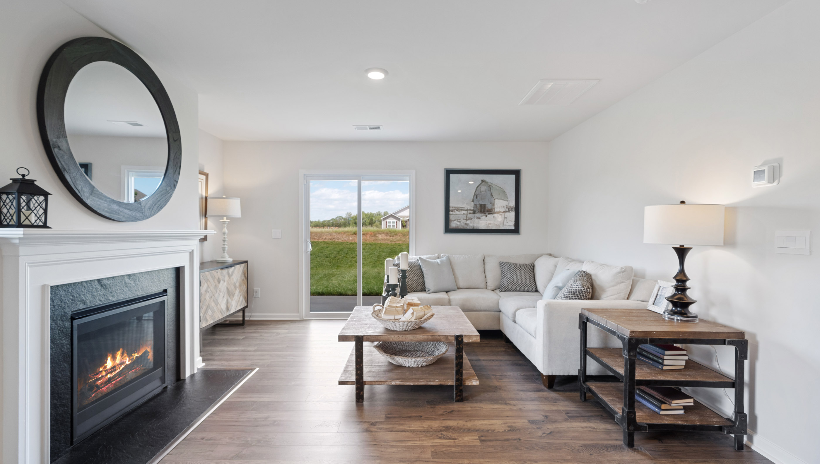 Family room with sliding door to patio and fireplace.
