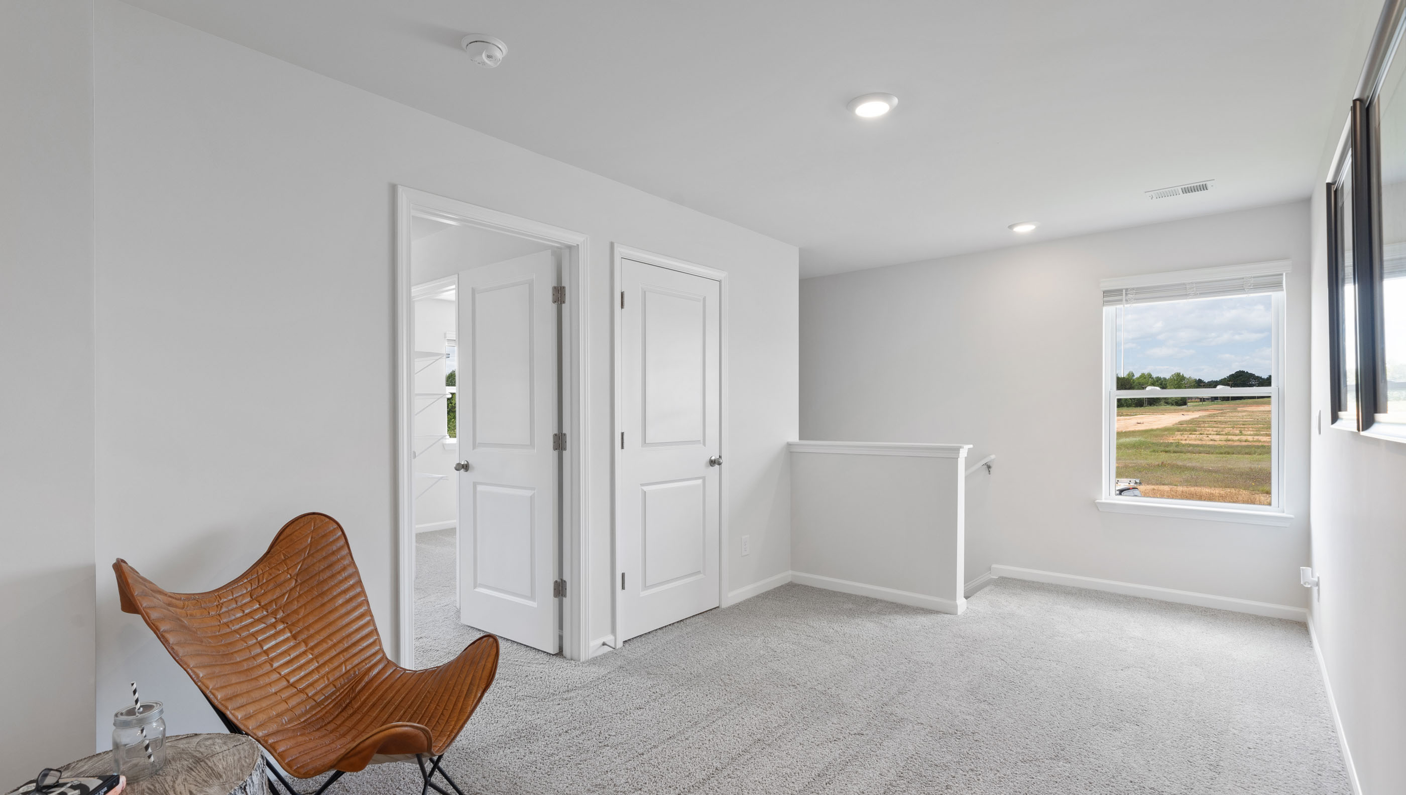 Loft area with large window.