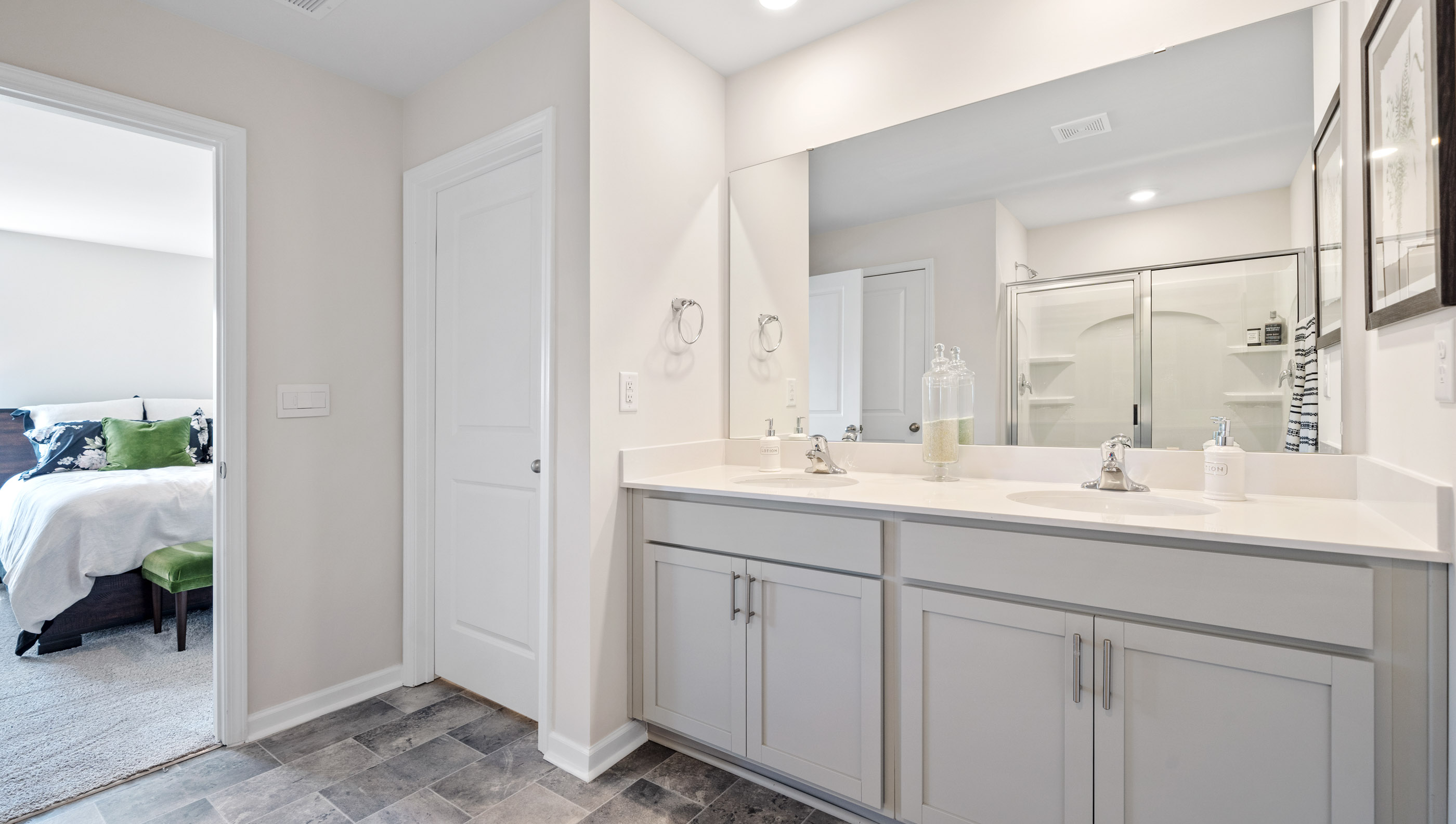 Primary bathroom with double sink vanity.