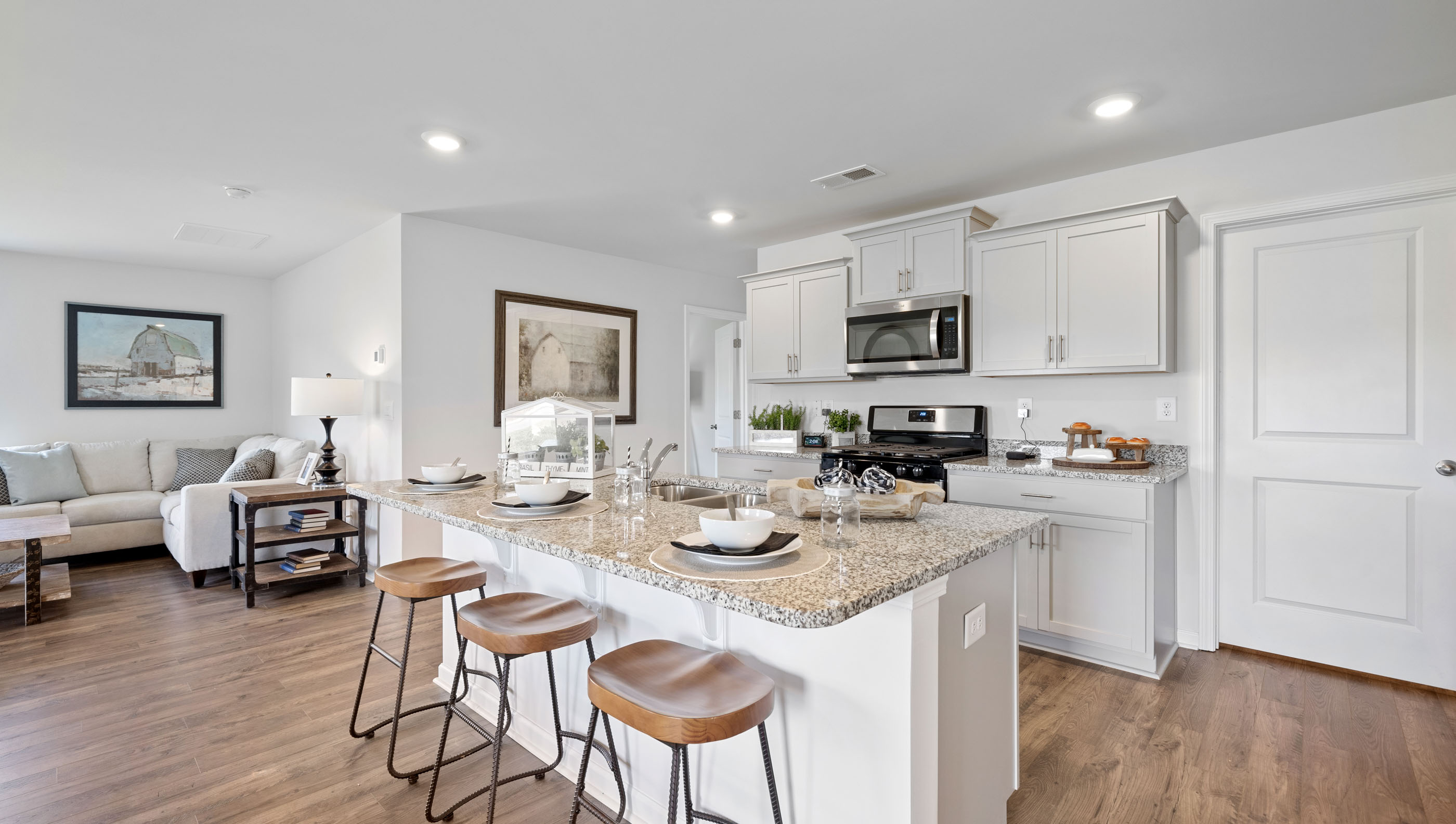 Kitchen with island and large modern cabinates.