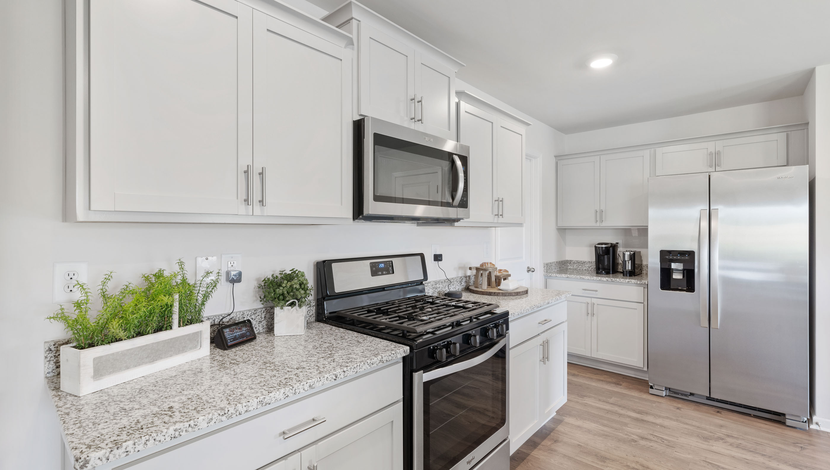 Kithcen with cabinates and stainless steel appliances.