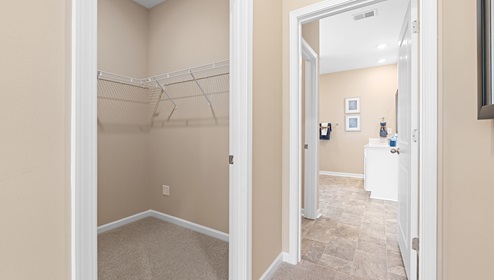 Closet with hanging storage racks.