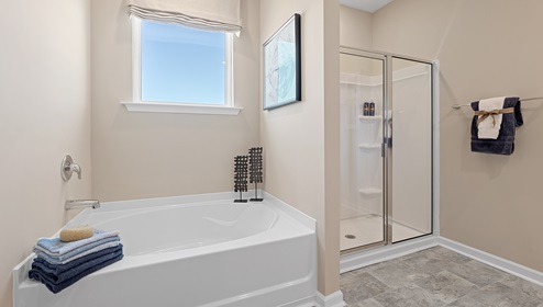 Bathroom with double vanity sink and shower.