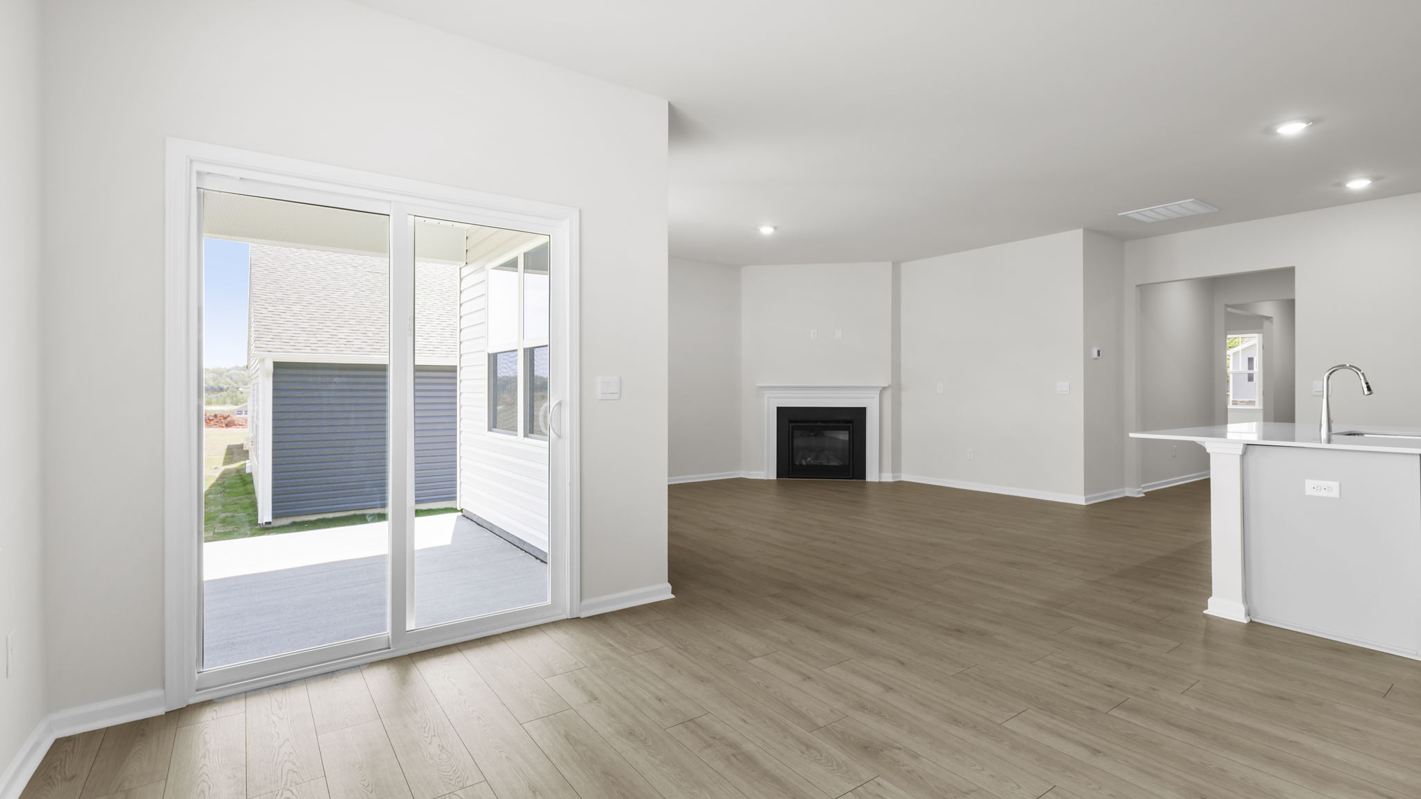 Family room with windows and fireplace.