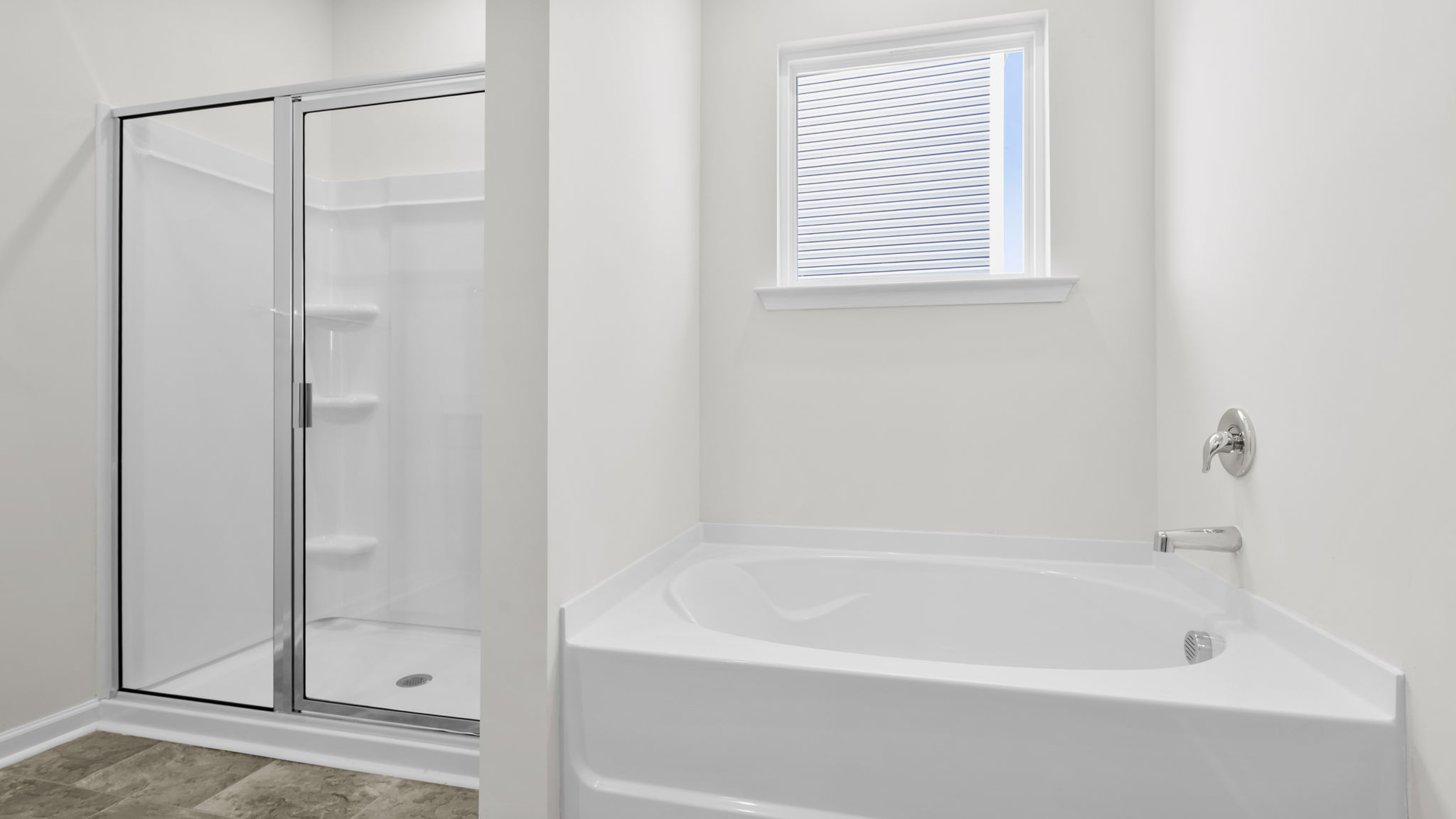 Bathroom with tub and walk in shower.