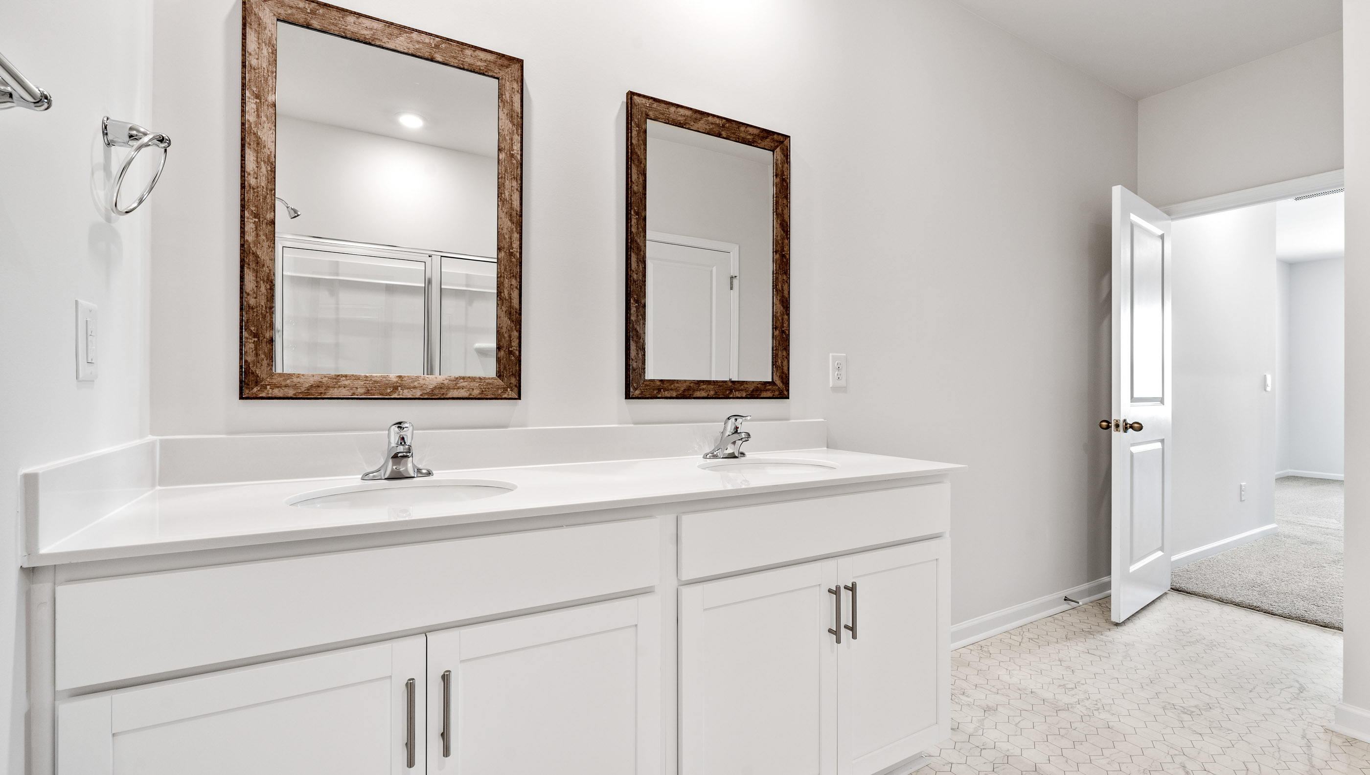 Primary bathroom with double vanity sinks.