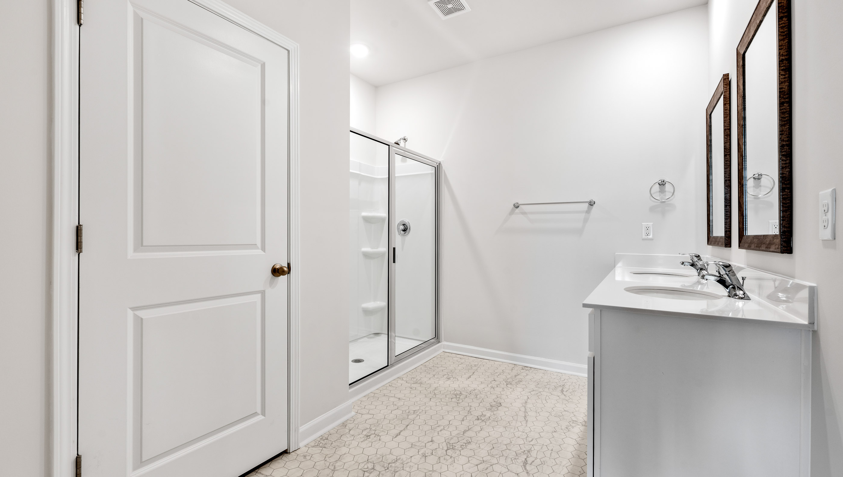 Primary bathroom with double vanity sinks.