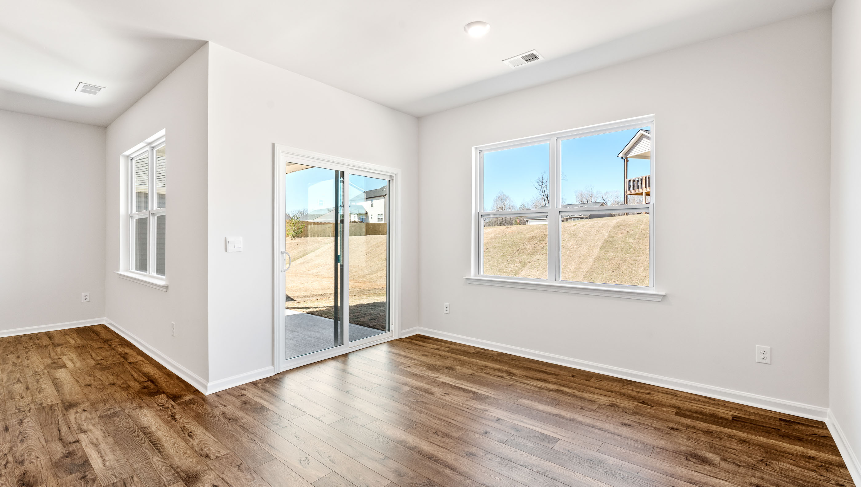 Living area with fireplace and windows.