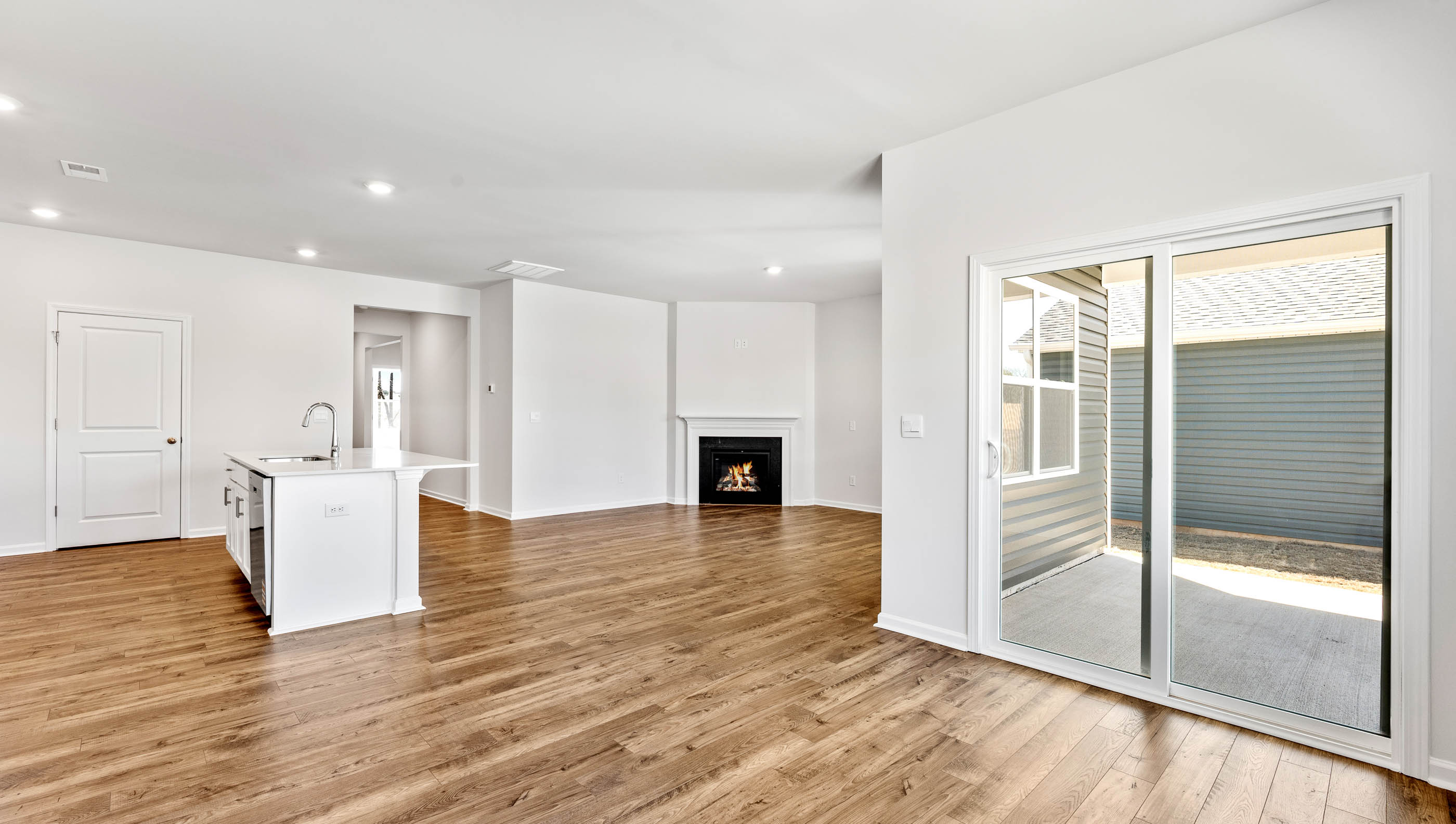 Living area with fireplace and windows.