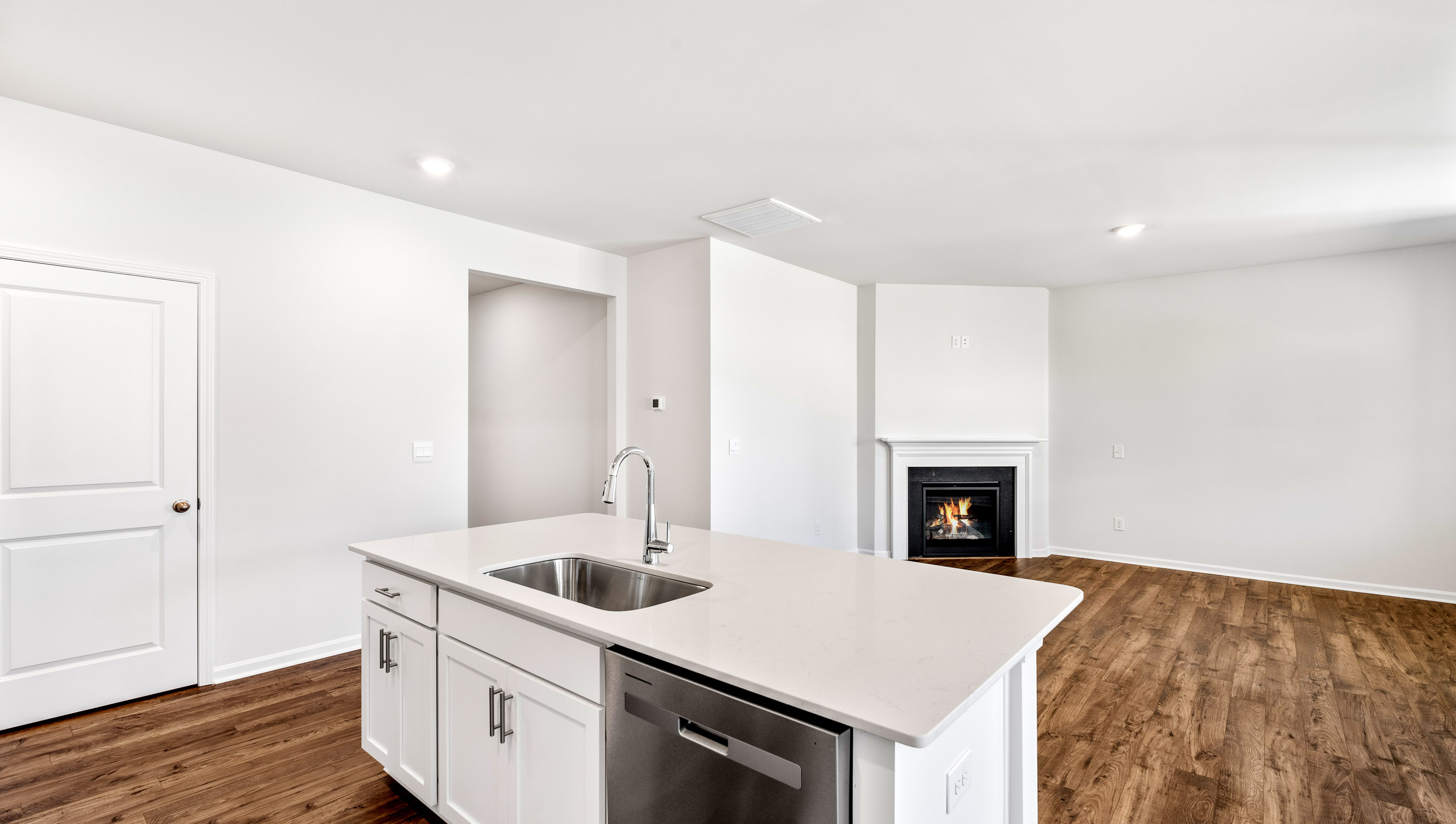 Kitchen with island and cabinets.