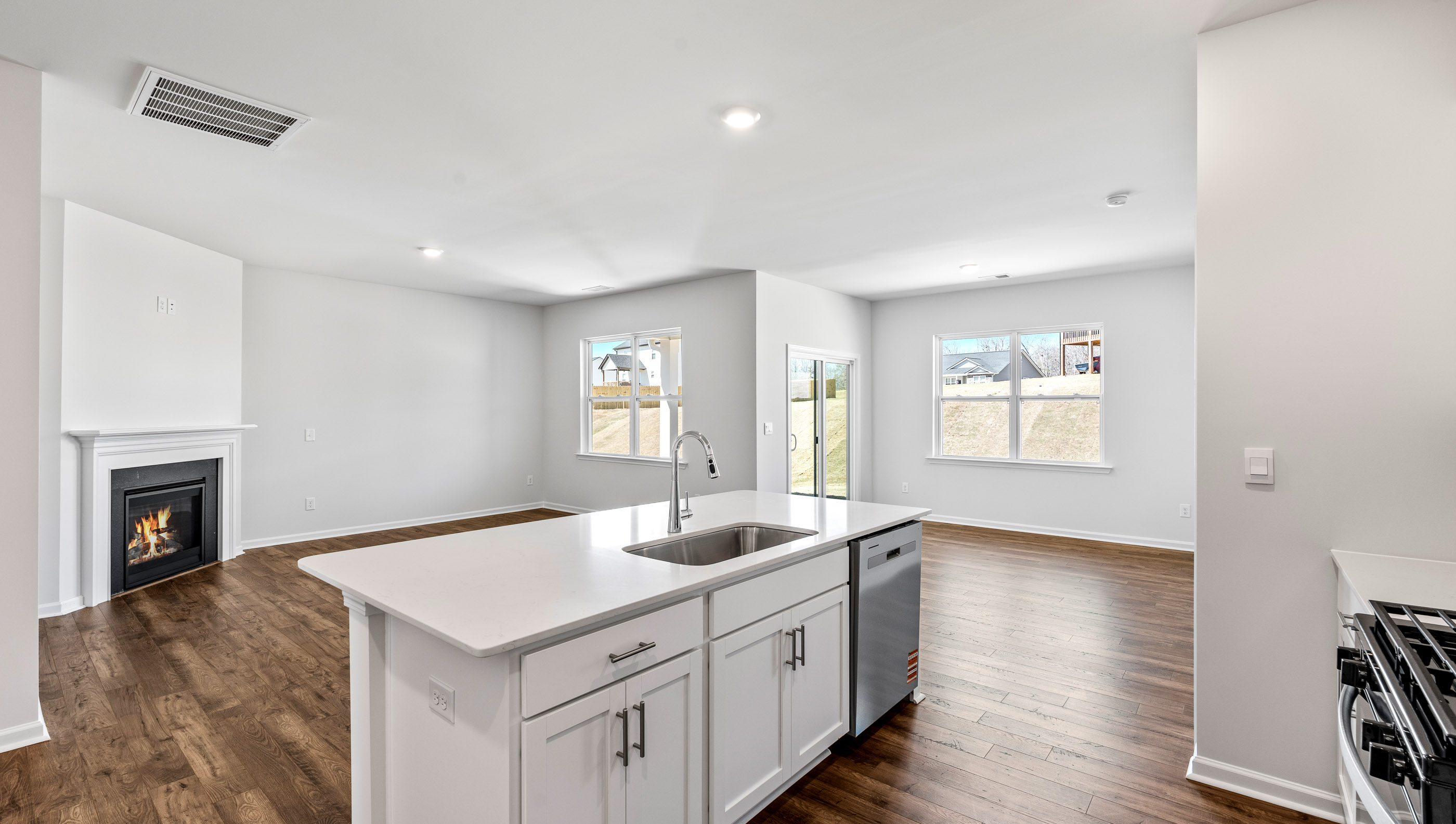 Kitchen with island and cabinets.