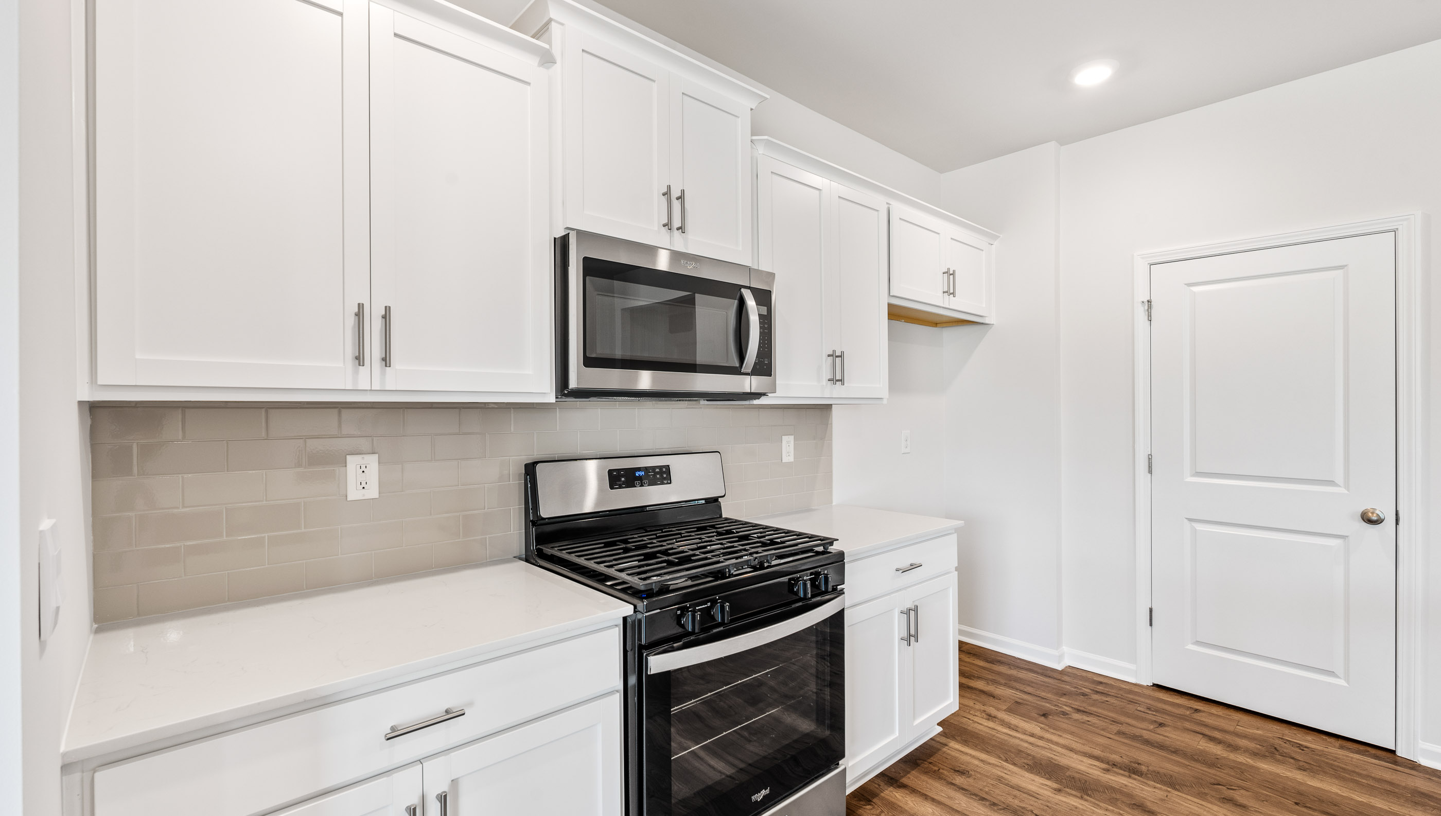 Kitchen with island and cabinets.