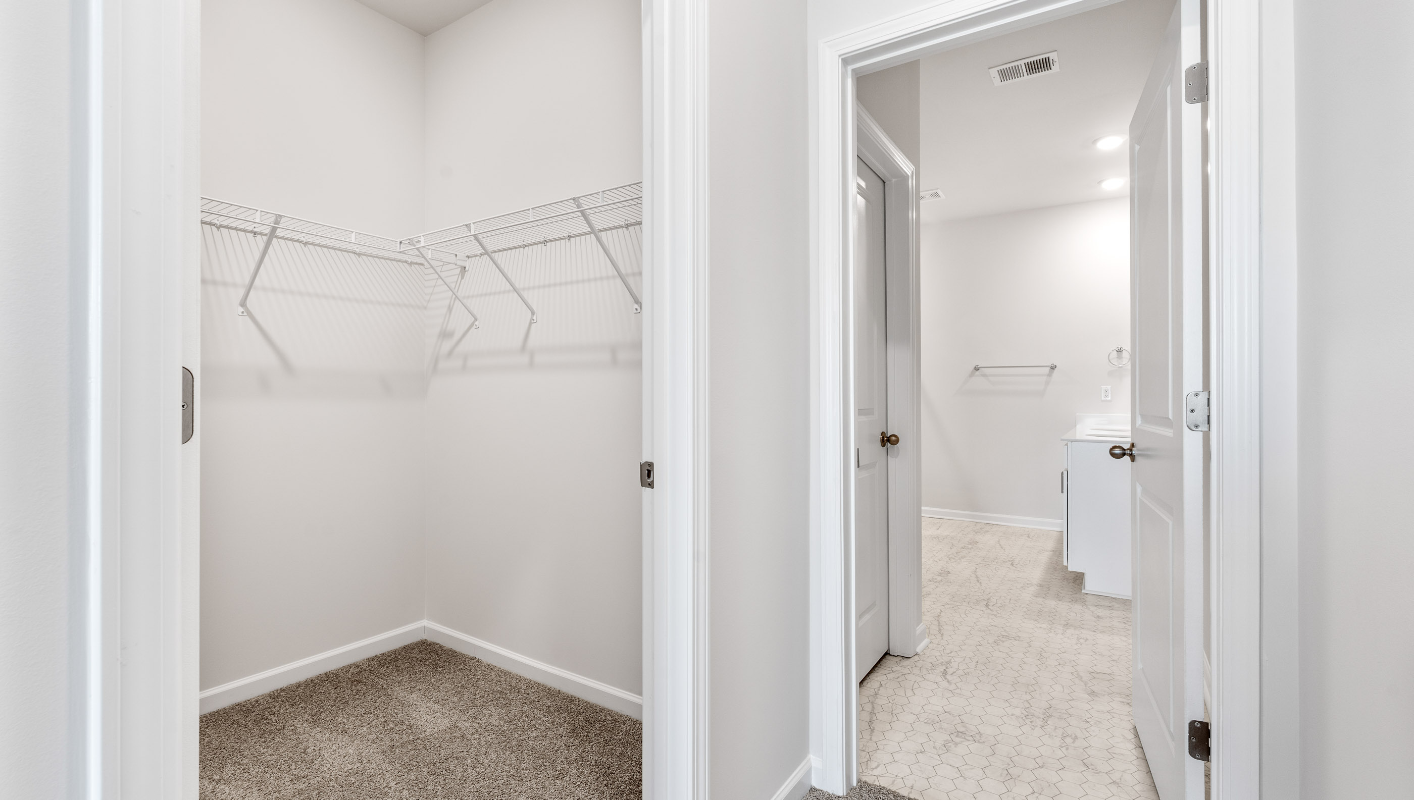 Primary bathroom with double vanity sinks.