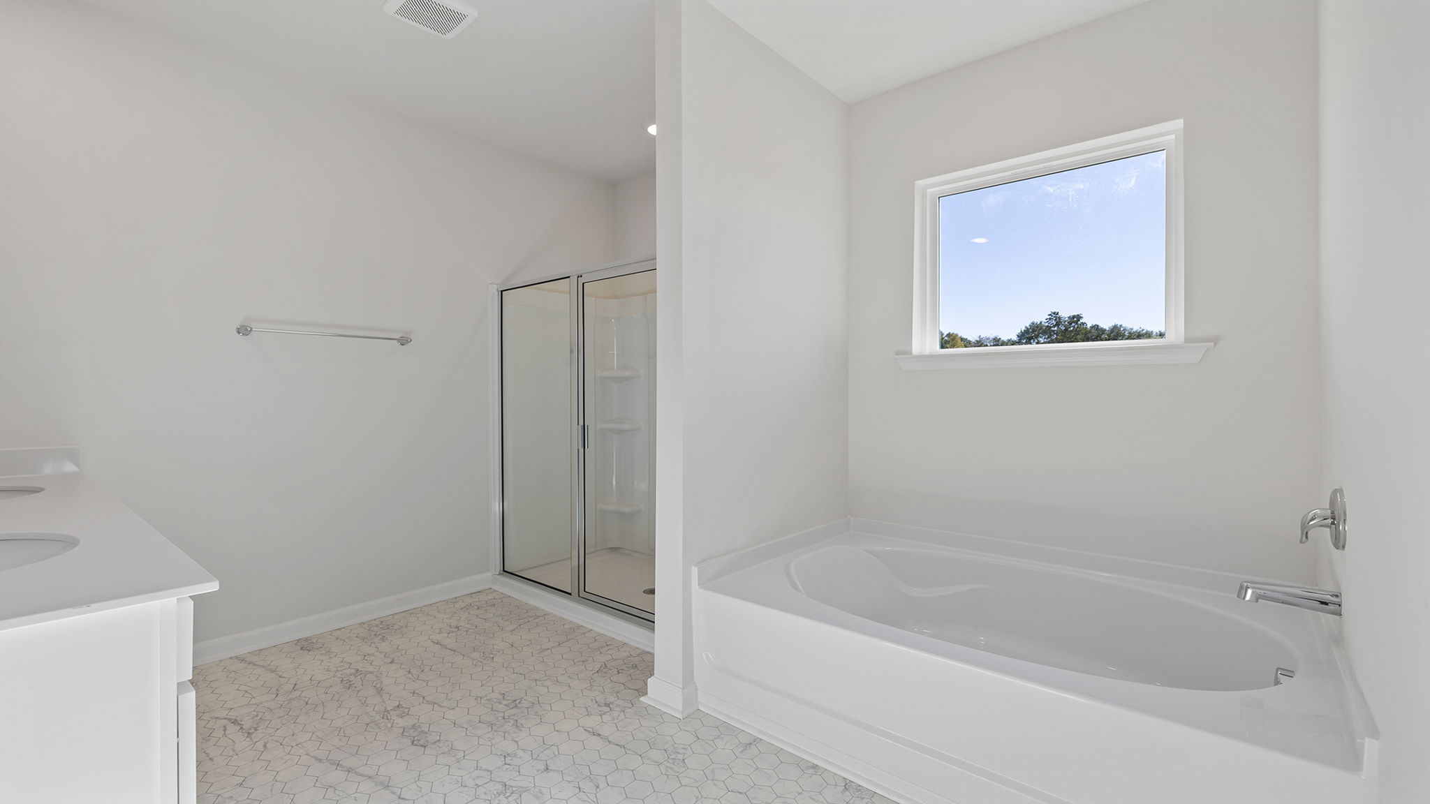 Primary bathroom with walk-in shower.  Garden tub is optional.