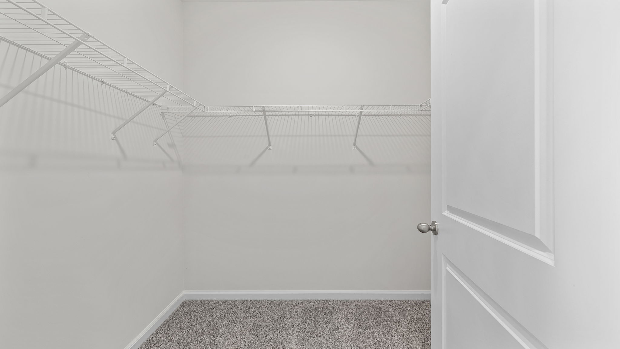 Primary bedroom walk-in closet.