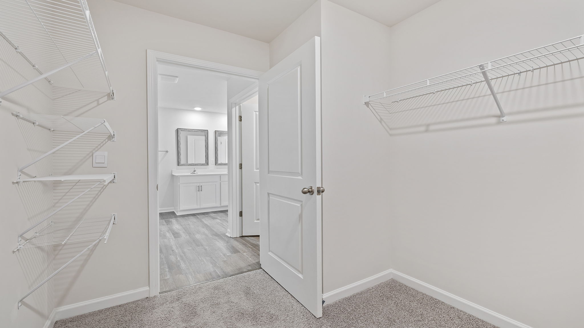 Primary bedroom walk-in closet.