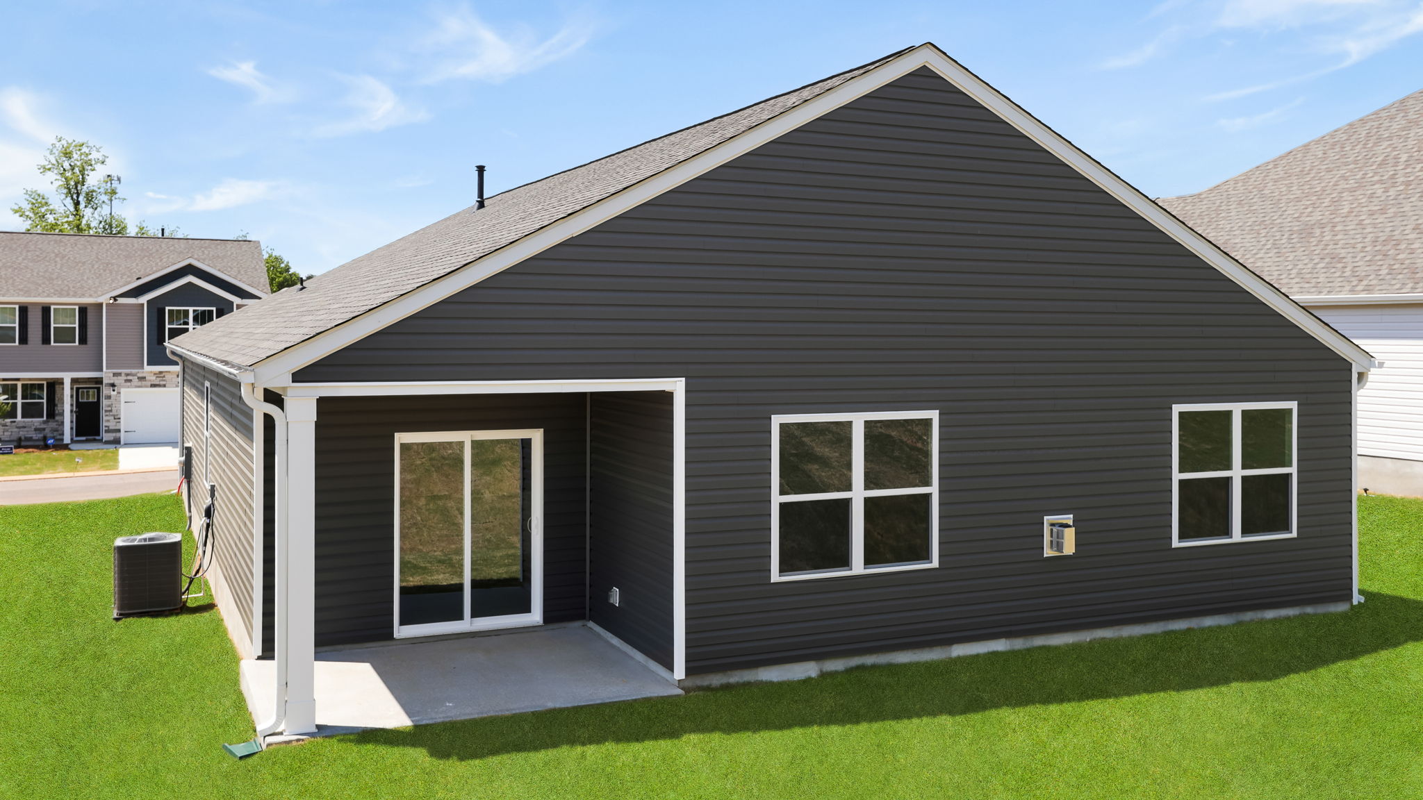 Back exterior of home with large backyard.