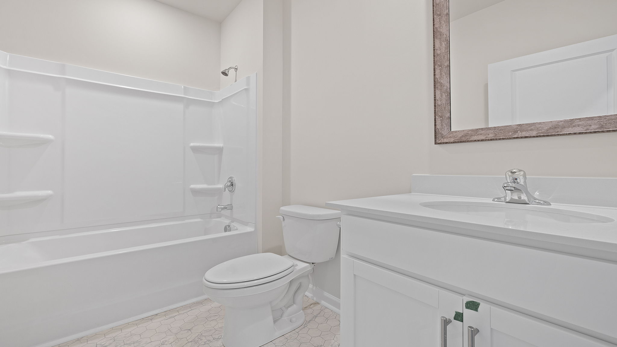 Hall bathroom with vanity and combination shower / tub.