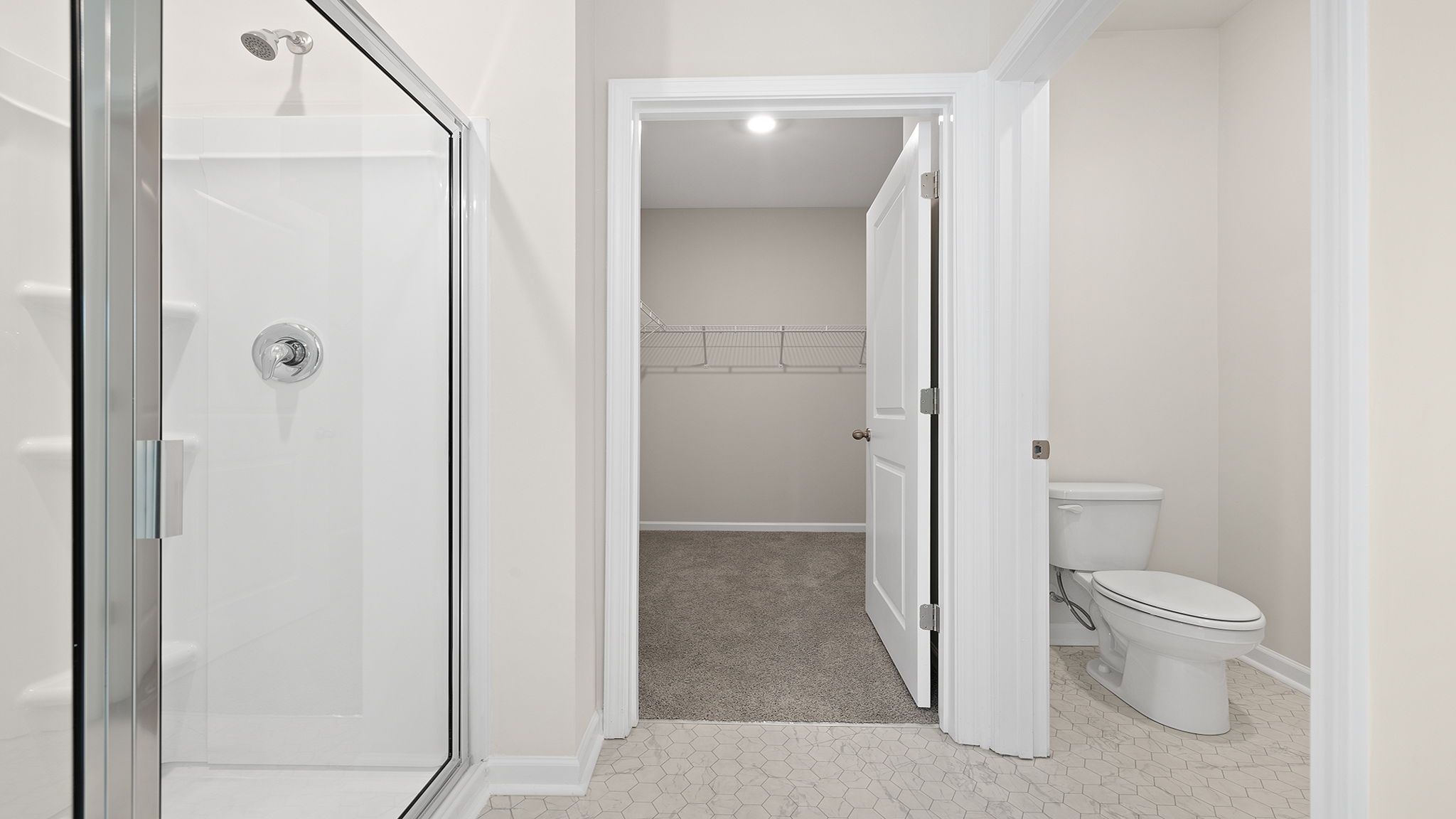 View of primary bedroom walk-in closet.