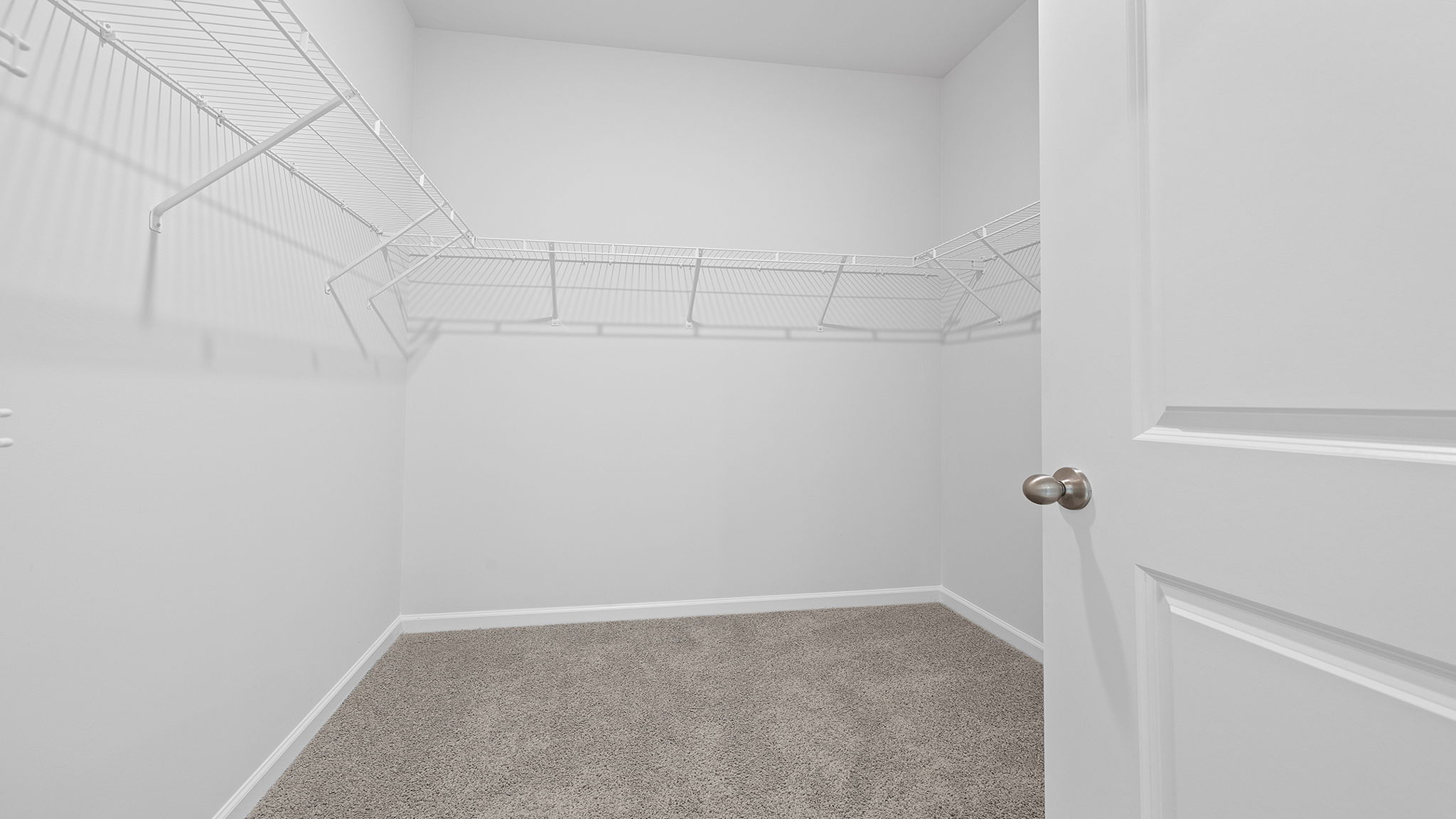 Primary bedroom walk-in closet.
