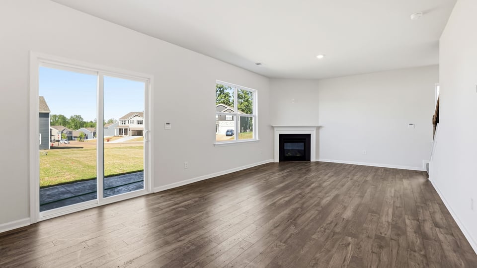 Family room with windows and fireplace.